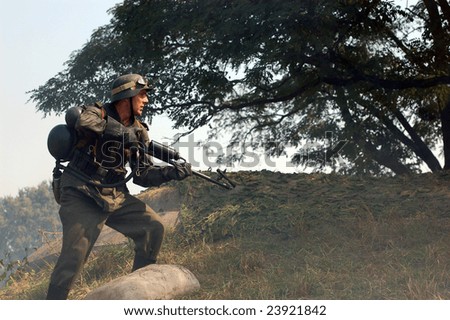 KIEV, UKRAINE - SEPTEMBER 6, 2008:  Person in German WW2 military uniform with flame-thrower. Historical military reenacting in Kiev, Ukraine, September 6, 2008.