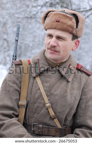 KORSUN, UKRAINE - FEB. 20: A member of the history club called Red Star wears a historical soviet uniform as he participates in a WWII reenactment. February 20, 2009 in Korsun, Ukraine.