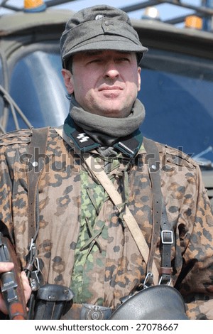 VINNITSA, UKRAINE - MAR 21: A member of a history club called Red Star wears a historical German uniform as he participates in a WWII reenactment in Vinnitsa, Ukraine March 21, 2009.