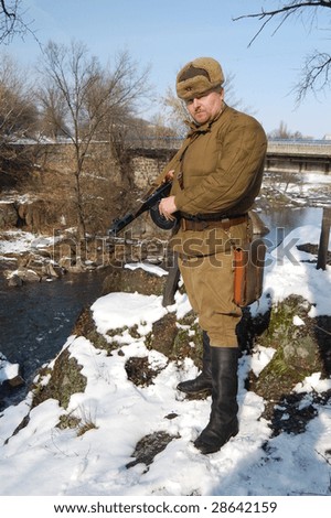 KORSUN, UKRAINE - FEB. 20: A member of the history club called Red Star wears a historical soviet uniform as he participates in a WWII reenactment. February 20, 2009 in Korsun, Ukraine.
