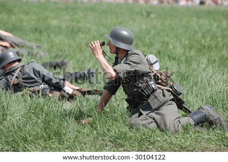 KIEV, UKRAINE - MAY 9: A member of a military history club wears a historical German uniform as he participates in a WWII reenactment May 9, 2009 in Kiev, Ukraine.