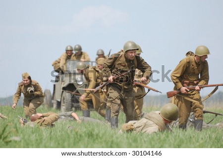 KIEV, UKRAINE - MAY 9: Members of history club called Red Star wear historical Soviet uniform as they participate in a WWII reenactment May 9, 2009 in Kiev, Ukraine.
