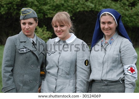KIEV,UKRAINE - 9 MAY: Woman in German WW2 military German nurse uniform. Member of military history club Red Star. Historical military reenacting in Kiev, Ukraine on May 9, 2009.