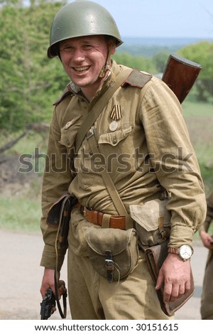 Member of history club  wear historical Soviet uniform as he participate in a WWII reenactment May 9, 2009 in Kiev, Ukraine