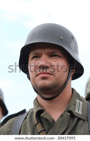 A member of a military history club Red Star wears a historical German uniform as he participates in a WWII reenactment May 9, 2009 in Kiev, Ukraine.