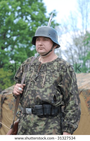 KIEV, UKRAINE - MAY 9: Member of a military history club wears historical German uniform as he participates in a WWII reenactment May 9, 2009 in Kiev, Ukraine.