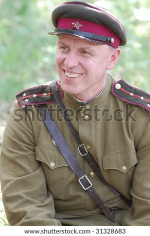 KIEV, UKRAINE - MAY 9: Member of history club called Red Star wears historical Soviet uniform as he participates in a WWII reenactment May 9, 2009 in Kiev, Ukraine.