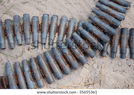 Old rusted World War II munition.German   cartridges in machine gun ribbon