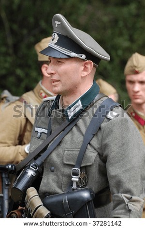 KIEV, UKRAINE - SEPT 6, : Member of a history club wear historical German uniforms as he participates in a WWII reenactment.Defense Kiev in 1941. September 6 , 2009 in Kiev, Ukraine