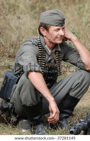 KIEV, UKRAINE - SEPT 6, : Member of a history club wear historical German uniforms as he participates in a WWII reenactment.Defense Kiev in 1941. September 6 , 2009 in Kiev, Ukraine