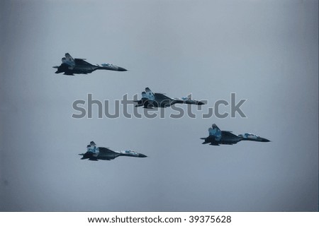 KIEV, UKRAINE - AUGUST 24 : Group of MIG-29 flies by at air parade during Ukraine independence day celebration August 24, 2009 in Kiev, Ukraine.