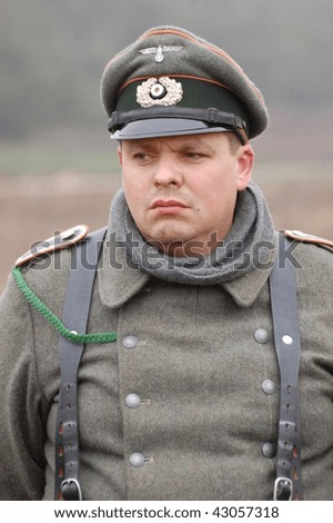 KIEV, UKRAINE - DEC 6: Member of a history club wears historical German uniforms during a WWII reenactment \'Defense Kiev\' in 1943 December 6, 2009 in Kiev, Ukraine.