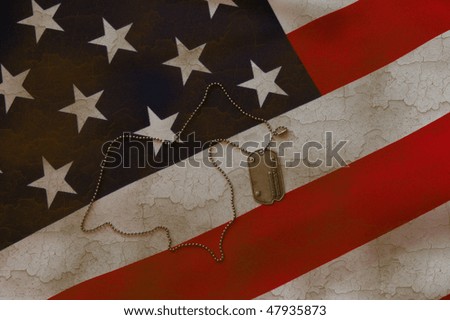 Dog tag on American flag.Grange