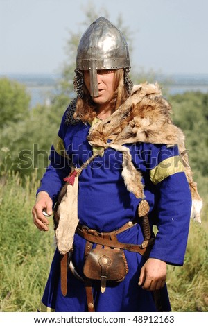 KIEV, UKRAINE - JULY 31: Member of history club Golden Capricorn wears medieval costume as he participates in historical festival and camp in memory King Vladimir July 31, 2009 in Kiev, Ukraine.