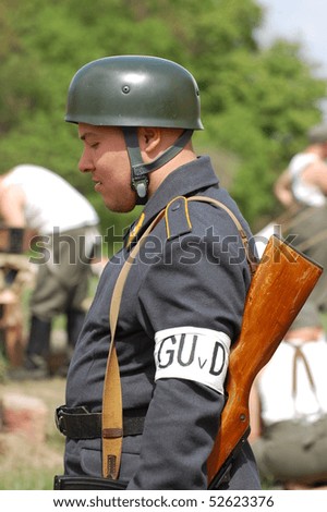 KIEV, UKRAINE - MAY 8 : A member of Red Star history club wears historical German uniform during historical reenactment of 1945 WWII, May 8, 2010 in Kiev, Ukraine.