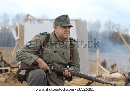 KIEV, UKRAINE - NOV 7: member of Red Star history club wears historical German uniform during historical reenactment of Kiev Liberation in 1943, November 7, 2010 in Kiev, Ukraine
