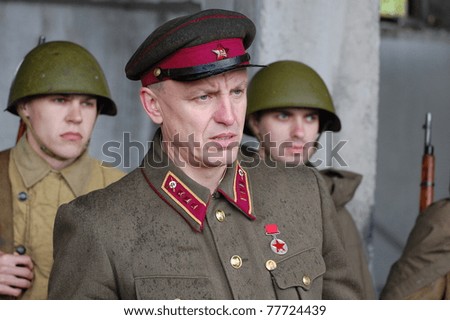 KIEV, UKRAINE - MAY 6 : Members of Red Star history club wear historical Soviet uniform during historical reenactment of WWII, May 6, 2011 in Kiev, Ukraine
