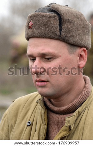 KIEV, UKRAINE -NOV 1: An unidentified member of Red Star history club wears historical Soviet uniform during historical reenactment of WWII, Dnepr river crossing 1943, November 1, 2013 Kiev, Ukraine