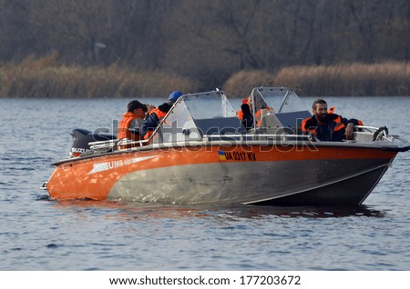 KIEV, UKRAINE -NOV 3: Ukrainian Civil Protection lifeboat during historical reenactment of WWII, Dnepr river crossing 1943, November 3, 2013 . Kiev, Ukraine
