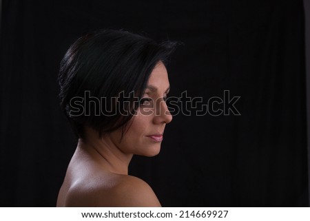 Woman profile portrait looking down