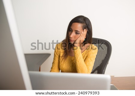 Businesswoman worry working on her computer at the office