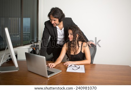 Business executives at the office working on the computer