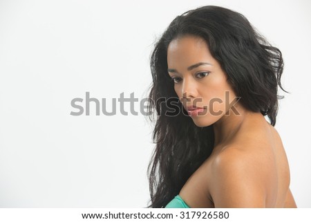 Mulatto profile  looking  down  showing her shoulder , neck and