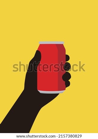 Hand holding a tin of coke