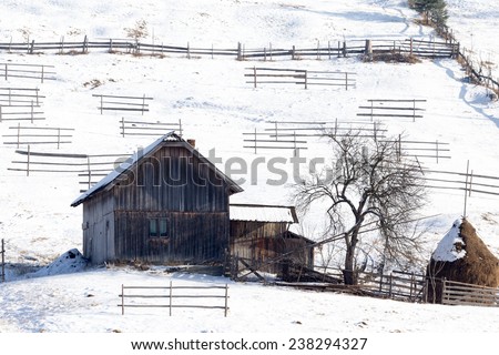 old wooden houses in winter time and snow landscape