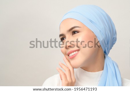A close up of young beautiful muslim woman with hijab isolated on white background studio, muslim beauty skin care concept.
