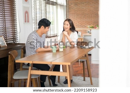 Similar – Foto Bild Fröhliches Paar beim Mittagessen im Cafe