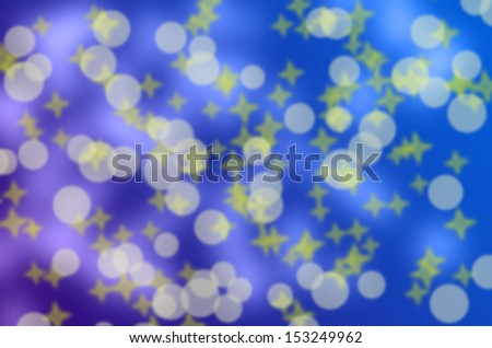 White and yellow bokeh on blue phone - abstract background.