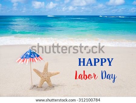 Labor Day USA background with starfishes and decorations on the sandy beach