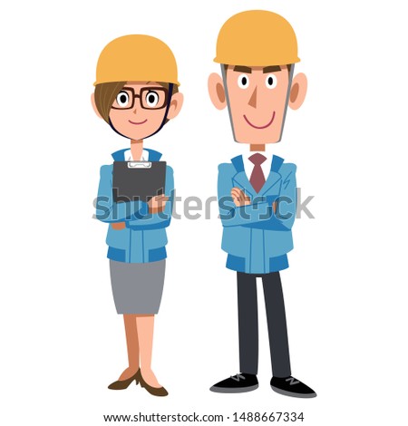 Man and woman on construction site wearing blue work clothes