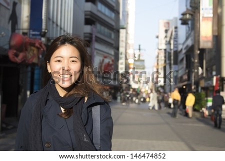 Asian girl smiling at japan