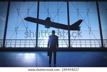 Business man standing silhouette in the airport