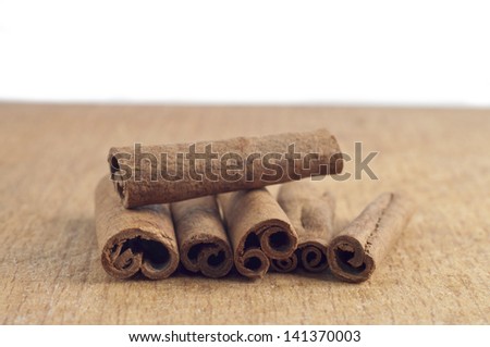 Cinnamon sticks on wood table close up