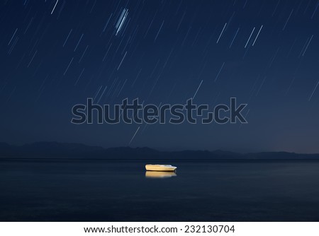 Boat under starry night