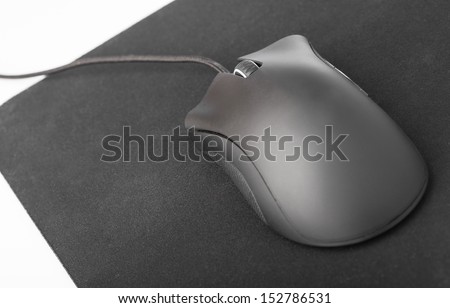 black computer mouse and pad on a white background