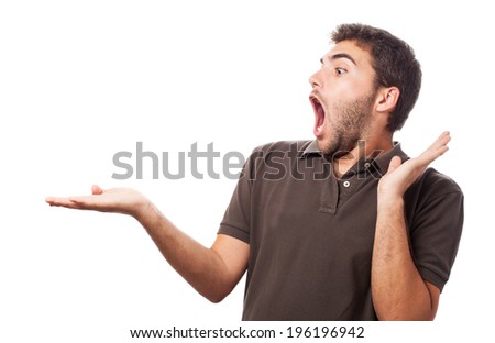 portrait of surprised man holding something in his hand