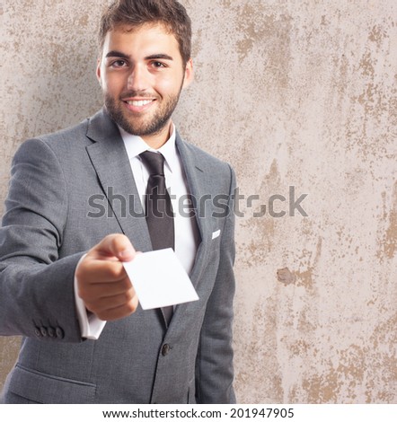 portrait of a caucasian young business man giving a personal card