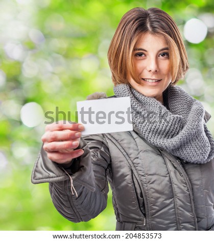 portrait of a pretty young woman showing her white card