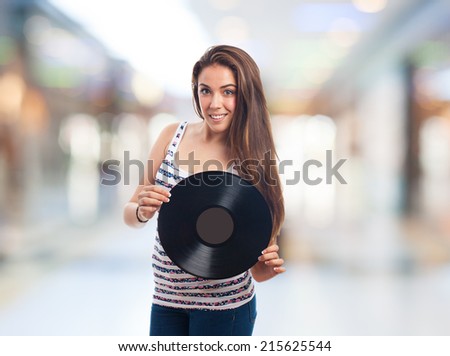 portrait of a young woman holding a vinyl