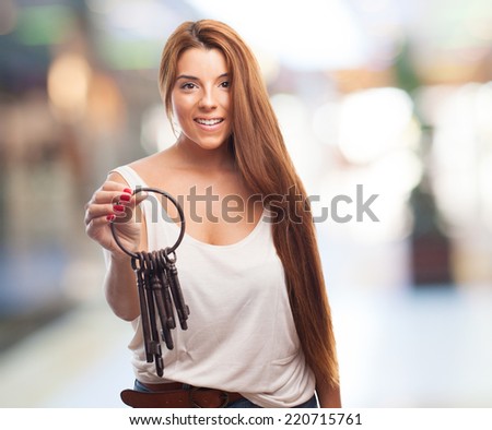 portrait of a young woman holding a vintage bunch of keys