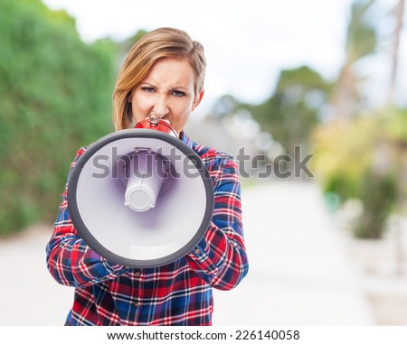 portrait of a pretty woman shouting with a megaphone