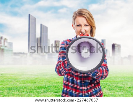 portrait of a pretty woman shouting with a megaphone