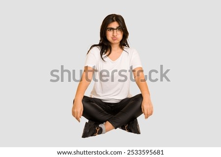 Similar – Image, Stock Photo woman sits annoyed in her living room and has a laughing smiley on her forehead (home office)