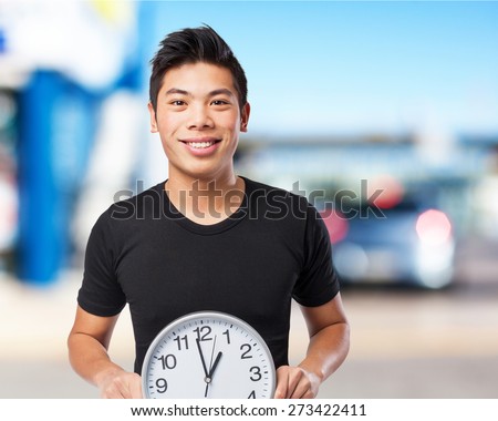 happy chinese sport man with clock