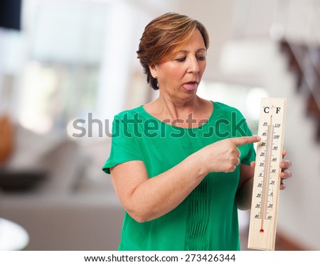 portrait of a mature woman sweating because of the heat