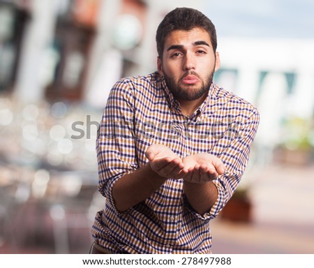 portrait of a young man asking for money